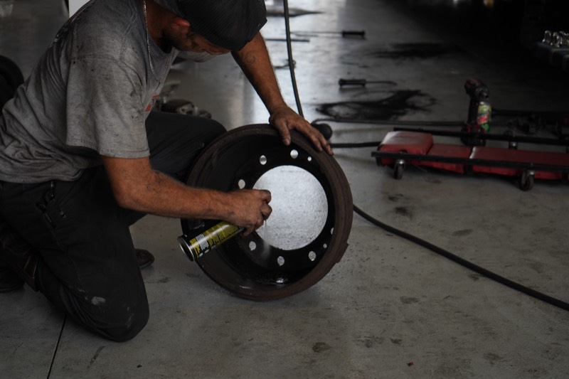 Certified technician performing wheel and brake service